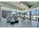 An open-concept living space with city views, sleek furniture, and modern lighting fixtures at 101 S 12Th St # 318, Tampa, FL 33602