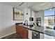 Bright and airy living room adjoins the kitchen area with modern appliances and island at 101 S 12Th St # 318, Tampa, FL 33602