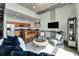Bright living room features concrete ceilings, modern furniture, and an open floor plan to the kitchen at 101 S 12Th St # 318, Tampa, FL 33602