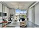 Bright living area features concrete floors, modern furniture, and an expansive window with views at 101 S 12Th St # 318, Tampa, FL 33602