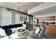 Stylish living room with concrete ceilings, modern decor, and a view into the open kitchen area at 101 S 12Th St # 318, Tampa, FL 33602