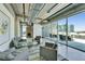 A comfortable lounge area with modern seating, city views, and access to an outdoor terrace at 101 S 12Th St # 318, Tampa, FL 33602