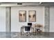 Office area features two modern paintings, a work desk, and a mini bar at 101 S 12Th St # 318, Tampa, FL 33602