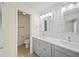 Updated bathroom features double vanity, modern fixtures, and tile accents at 107 Seville N Ct, Plant City, FL 33566