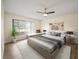 Cozy bedroom with ample natural light, ceiling fan, and modern decor at 107 Seville N Ct, Plant City, FL 33566