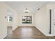 Dining room featuring tile floors, neutral walls, and modern light fixture at 107 Seville N Ct, Plant City, FL 33566