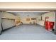 Garage with concrete floor, shelving, and plenty of space at 107 Seville N Ct, Plant City, FL 33566