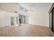 Living room featuring tile floors, neutral walls, vaulted ceilings, and lots of natural light at 107 Seville N Ct, Plant City, FL 33566