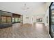 Living room with wood floors, fan, and vaulted ceilings at 107 Seville N Ct, Plant City, FL 33566