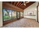 Covered patio features a wood ceiling and exterior views at 107 Seville N Ct, Plant City, FL 33566