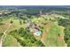 Aerial view of community with golf course, pool, and mature trees at 1233 Emerald Hill Way, Valrico, FL 33594