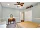 Bedroom with light walls, carpet flooring, a ceiling fan and closet storage at 1233 Emerald Hill Way, Valrico, FL 33594
