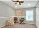 Inviting bedroom with chair, keyboard, ceiling fan, and natural light at 1233 Emerald Hill Way, Valrico, FL 33594
