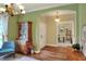 Inviting foyer featuring hardwood floors, archway, and stylish decor elements at 1233 Emerald Hill Way, Valrico, FL 33594