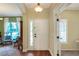 Interior front entrance of the house with hardwood floors, and views of an office and living room at 1233 Emerald Hill Way, Valrico, FL 33594
