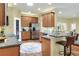 Open kitchen with a breakfast bar, stainless steel appliances, and ample cabinet space at 1233 Emerald Hill Way, Valrico, FL 33594