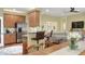 Modern kitchen with breakfast bar, stainless steel appliances, and an open floor plan at 1233 Emerald Hill Way, Valrico, FL 33594