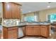 Kitchen area featuring stainless steel appliances, breakfast bar and a window with natural light at 1233 Emerald Hill Way, Valrico, FL 33594
