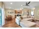 Spacious living area with hardwood floors, a dining area, and an open kitchen at 1233 Emerald Hill Way, Valrico, FL 33594