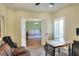 Spacious office area with a work desk and comfortable seating that connects to the living room at 1233 Emerald Hill Way, Valrico, FL 33594