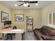 Office with a comfortable sofa, work space, large windows and neutral paint at 1233 Emerald Hill Way, Valrico, FL 33594