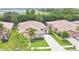 Aerial view of the home and property showcasing the beautiful landscaping and tile roof, creating great curb appeal at 163 Shell Falls Dr, Apollo Beach, FL 33572
