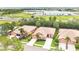 An aerial view showcases the community with lush landscaping, well-maintained homes, and proximity to commercial areas at 163 Shell Falls Dr, Apollo Beach, FL 33572