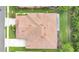 An overhead view displaying a home with a tiled roof, a screened in lanai and neat landscaping at 163 Shell Falls Dr, Apollo Beach, FL 33572