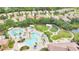 Aerial view of the community pool with palm trees and lush landscaping at 163 Shell Falls Dr, Apollo Beach, FL 33572