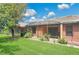 Expansive backyard with manicured lawn, mature trees, and a screened-in lanai, perfect for outdoor living and entertaining at 163 Shell Falls Dr, Apollo Beach, FL 33572