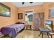 Cozy bedroom featuring a window overlooking the property and wooden furniture at 163 Shell Falls Dr, Apollo Beach, FL 33572