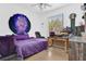 Bedroom with purple bedding, light colored flooring and white colored walls at 163 Shell Falls Dr, Apollo Beach, FL 33572