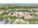 Overhead shows a resort-style community pool with lush landscaping, comfortable lounging areas, and vibrant social spaces at 163 Shell Falls Dr, Apollo Beach, FL 33572