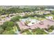 An aerial view shows the community pool area with an array of lounge chairs and a bocce ball court at 163 Shell Falls Dr, Apollo Beach, FL 33572