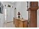 Traditional foyer featuring a decorative cabinet, grandfather clock, and tile flooring at 163 Shell Falls Dr, Apollo Beach, FL 33572