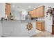 Open-concept kitchen featuring ample cabinet storage and views into the dining area at 163 Shell Falls Dr, Apollo Beach, FL 33572
