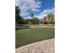 Scenic putting green with manicured turf and nearby clubhouse in Del Webb at 163 Shell Falls Dr, Apollo Beach, FL 33572