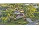 Aerial view of a home nestled among mature trees at 607 N Merrin St, Plant City, FL 33563