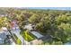 Aerial view of a beautiful property with a long driveway and lush green surroundings at 607 N Merrin St, Plant City, FL 33563