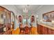 Traditional dining room with hardwood floors, chandelier, built-in shelving and decorative dishware on display at 607 N Merrin St, Plant City, FL 33563