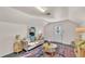 Bright living room with a comfortable sofa, stylish decor, and a large window for natural light at 607 N Merrin St, Plant City, FL 33563