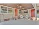 Relaxing covered patio with seating and a charming outdoor living space at 607 N Merrin St, Plant City, FL 33563