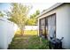 Well-maintained backyard with a screened-in lanai, offering both comfort and outdoor enjoyment at 11567 Misty Isle Ln, Riverview, FL 33579