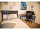 Bedroom featuring modern decor, neutral tones, and a desk at 11567 Misty Isle Ln, Riverview, FL 33579