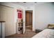 Bedroom featuring doorway, closet, neutral carpet and wall decor at 11567 Misty Isle Ln, Riverview, FL 33579