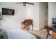 Bedroom featuring modern decor with an office space and ceiling fan at 11567 Misty Isle Ln, Riverview, FL 33579