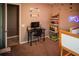 bedroom with neutral carpet, desk, and fun dinosaur themed decorations at 11567 Misty Isle Ln, Riverview, FL 33579