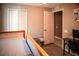 Bedroom featuring neutral carpet, decor, and doorway to hallway at 11567 Misty Isle Ln, Riverview, FL 33579