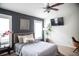 Bedroom featuring dark blue walls, stylish decor, and an entertainment area at 11567 Misty Isle Ln, Riverview, FL 33579