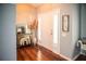 Welcoming foyer with hardwood floors, a console table, and a bright, inviting atmosphere at 11567 Misty Isle Ln, Riverview, FL 33579